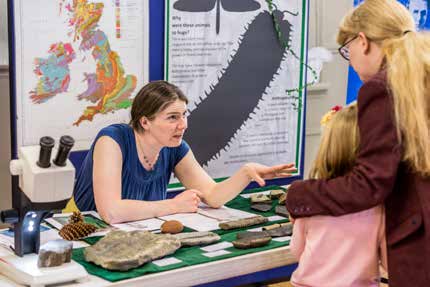Engaging with the public at an exhibit about the Carboniferous Engaging with the public at an exhibit about the Carboniferous